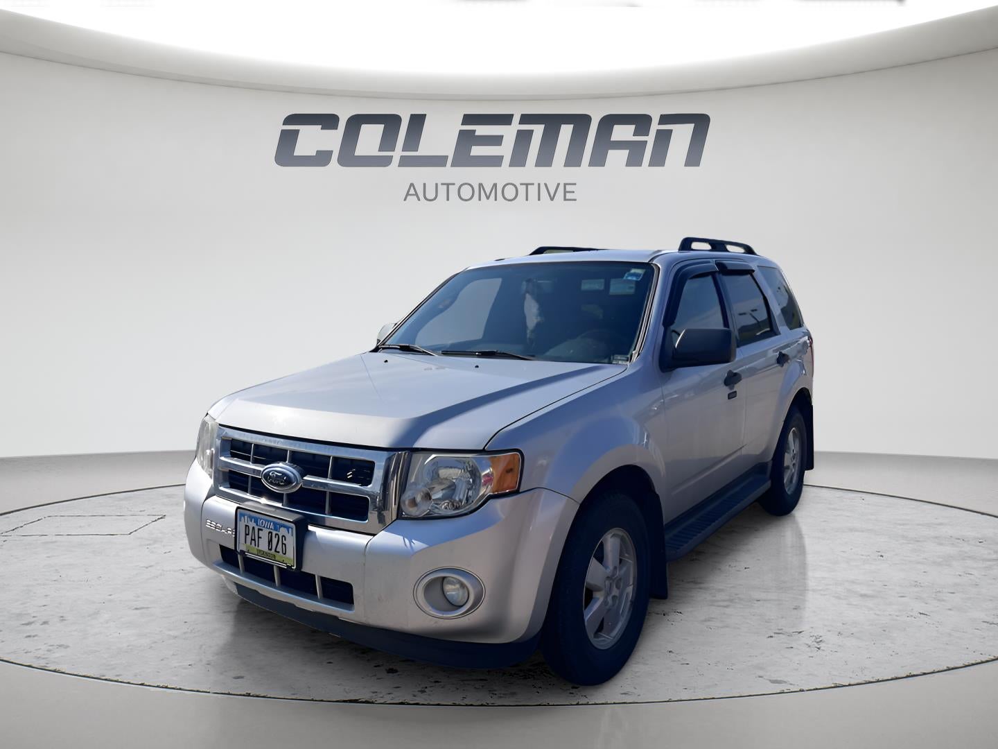 2010 Ford Escape XLT in Oxford White (Fleet) — front three-quarter view