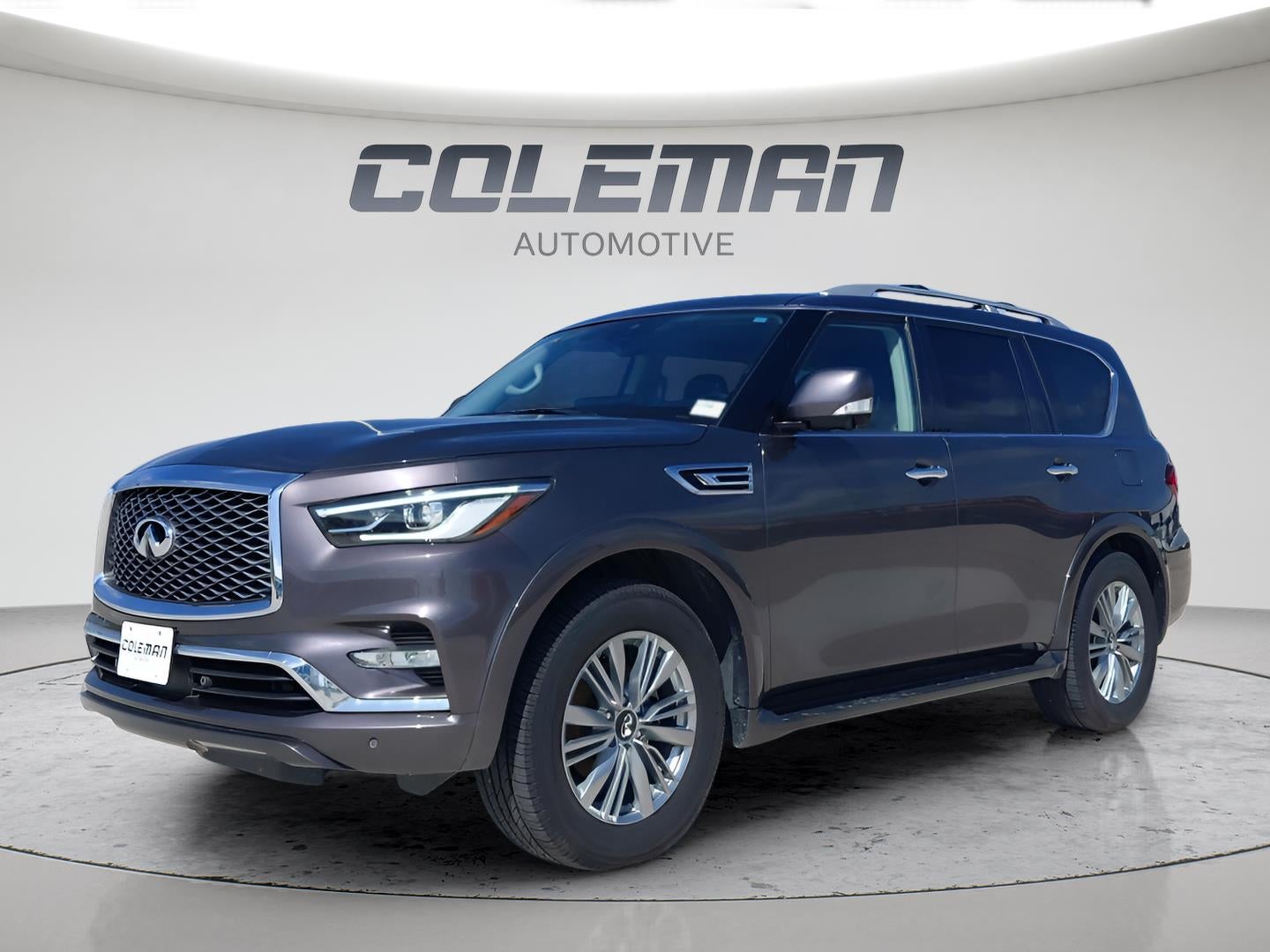 2024 INFINITI QX80 LUXE in Anthracite Gray — front three-quarter view